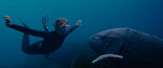 Opening image: Mia Wasikowska as Abby, finally reunited with her beloved Blueback after years abroad and a lifetime working for its protection.