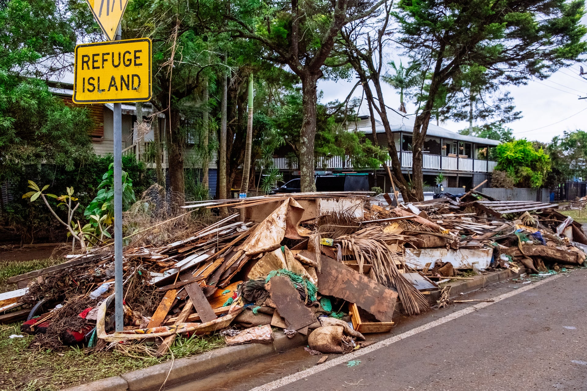 In the days after the February 27 flood, the streets of Lismore were lined with the muddy, discarded ruins of peoples' lives. Photo Andy Summons