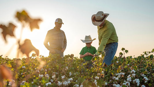 Three generations of West Texas farmers: Jerry, Aaron and Logan Vogler. The three live and work on their 300 acres of land near Lamesa, growing organic cotton and peanuts. Photo: Giles Clement