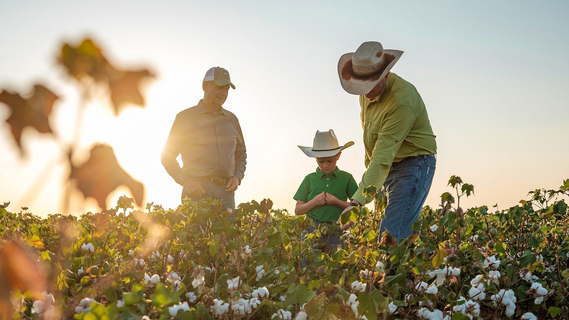 Three generations of West Texas farmers: Jerry, Aaron and Logan Vogler. The three live and work on their 300 acres of land near Lamesa, growing organic cotton and peanuts. Photo: Giles Clement