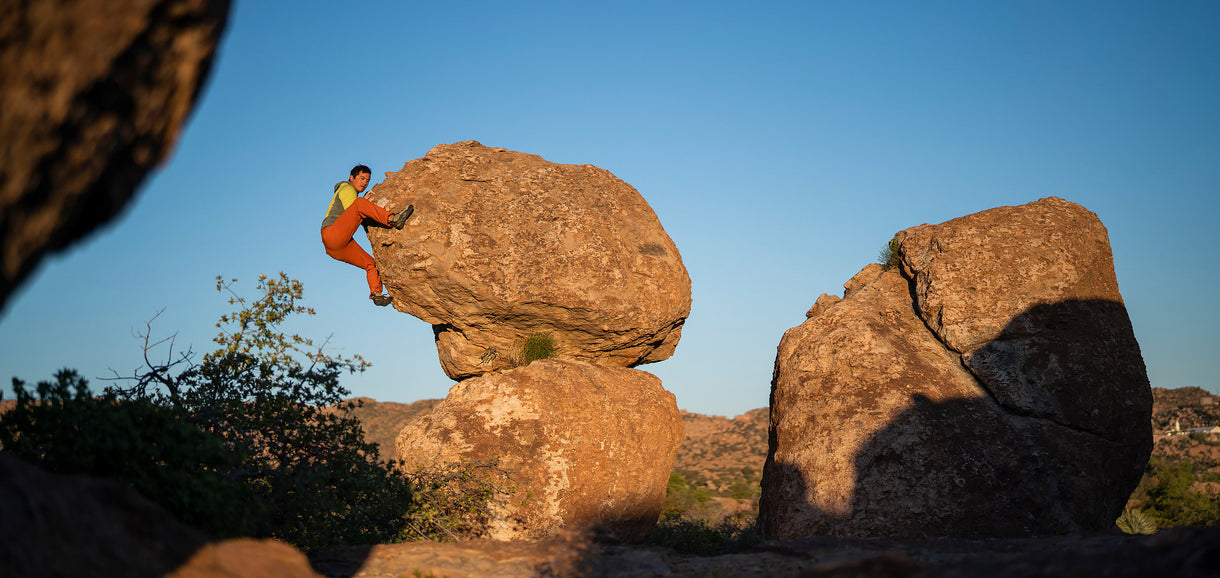 Aaron Mike climbs an unknown boulder at Oak Flat. Tonto National Forest, Arizona.