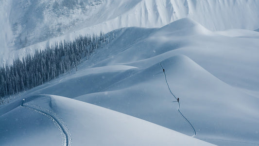 If ever there was a worthy canvas, it would be Rogers Pass in British Columbia’s Selkirk Mountains. Two artists drag a moody brushstroke on one of the area’s many ridgelines. Photo: Bruno Long