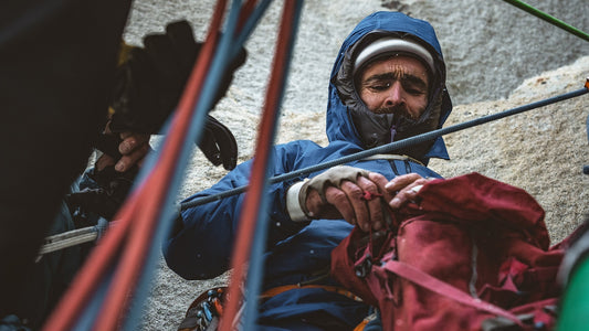Patagonia Ambassador Sean Villanueva O’Driscoll digs for his daily ration on day 15 of Riders on the Storm. This was his, Nico Favresse and Siebe Vanhee’s first free ascent of the route. Torres del Paine National Park, Chile.
