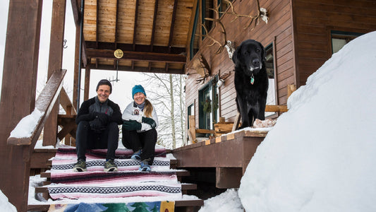 Mark, Margaret and Sadie, on the porch of their Montana home. Photo: Tim Davis