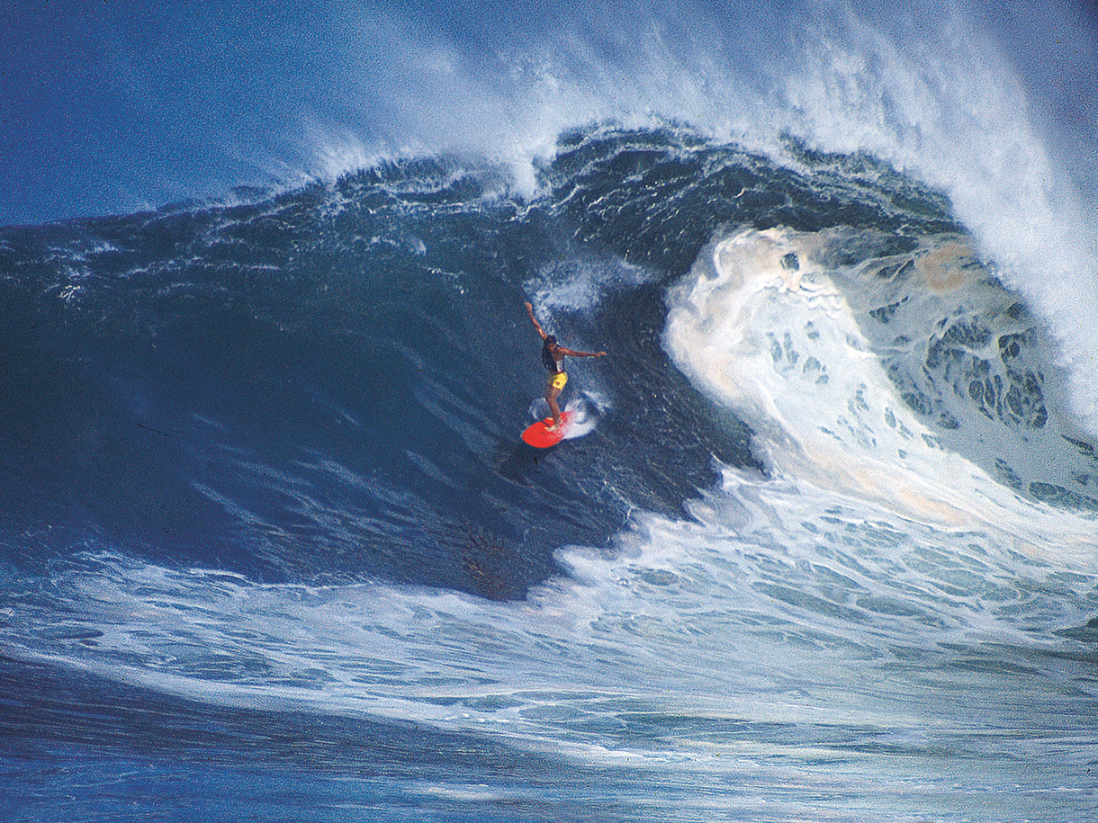 Surfing for prize money makes surfers take chances they might not take on just a regular surf day. Here, Barry Kanaiaupuni is about to take a licking and, at this moment, probably knows it.